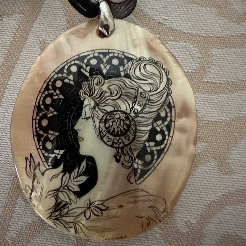 Shell cameo-style design of a lovely lady. Handmade pendant.